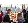 happy family enjoying lunch time together young parents with kids enjoying delicious meal at luxury restaurant