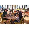 happy family enjoying lunch time together young parents with kids enjoying delicious meal at luxury restaurant