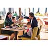 happy family enjoying lunch time together young parents with kids enjoying delicious meal at luxury restaurant