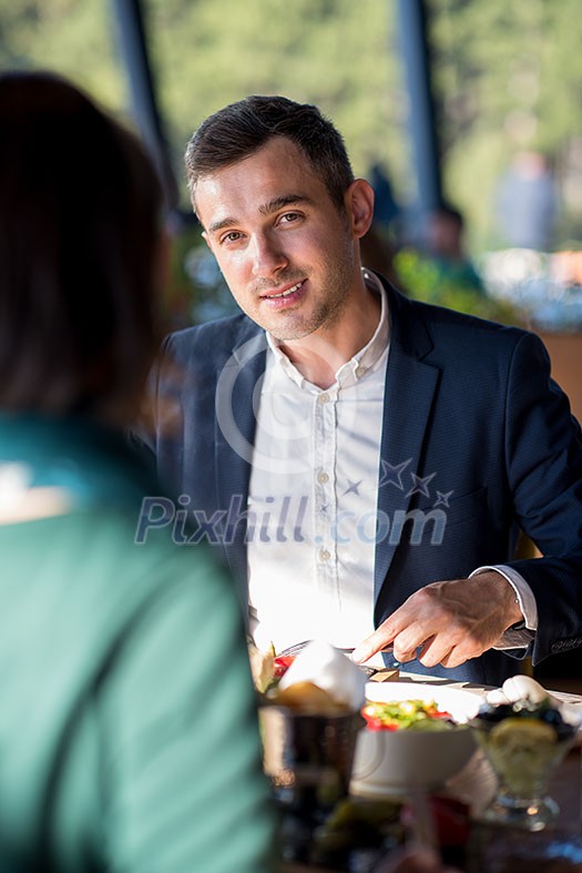 happy smiling loving couple enjoying free time looking eachother while having lunch at luxury restaurant happy smiling loving couple enjoying free time looking eachother while having lunch at luxury restaurant