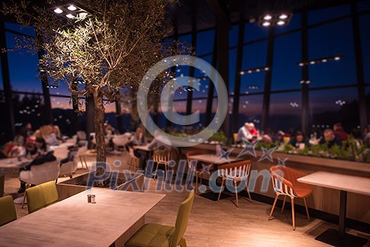 People enjoy in the lovely evening at a luxury restaurant People enjoy in the lovely evening at a luxury restaurant