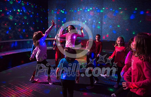 A group of joyful children happily spending time at Kids neon disco party