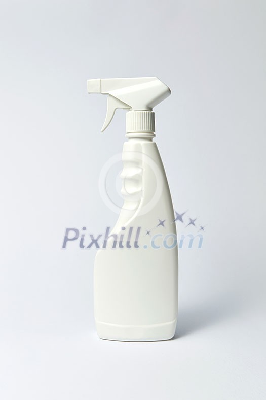 White blank plastic spray detergent bottle on light gray background, with copy space. Mockup. White blank plastic spray detergent bottle on light gray background, with copy space. Mockup.