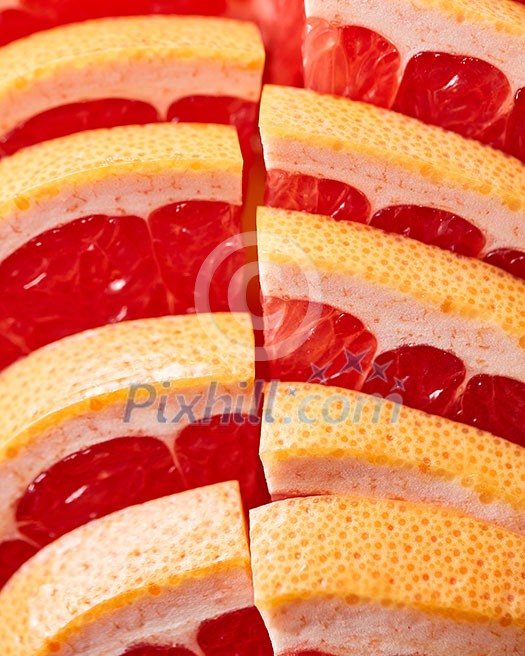 Composition of juicy slices of ripe grapefruit. Healthy Organic Fruit. Flat lay Composition of juicy slices of ripe grapefruit. Healthy Organic Fruit. Flat lay