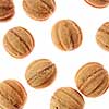 Bakery pattern from homemade fresh cookies in a shape of nuts on a white background.