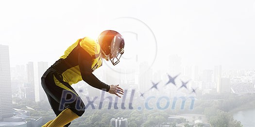 American football player against modern city background American football player against modern city background