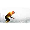American football player against modern city background