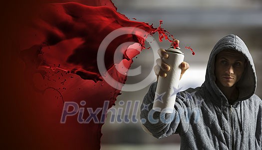 Man hiding face with hoodie and spraying paint with balloon. Mixed media Man hiding face with hoodie and spraying paint with balloon. Mixed media