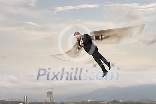 Cheerful businessman with paper wings flying in sky. Mixed media Cheerful businessman with paper wings flying in sky. Mixed media