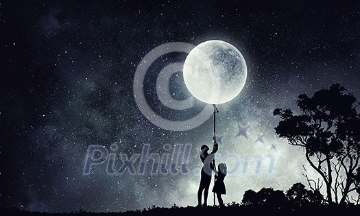 Young happy family of mother and daughter catching moon with rope Young happy family of mother and daughter catching moon with rope