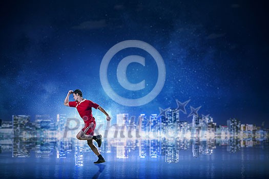 Active sportsman in red uniform running fast. Mixed media Active sportsman in red uniform running fast. Mixed media