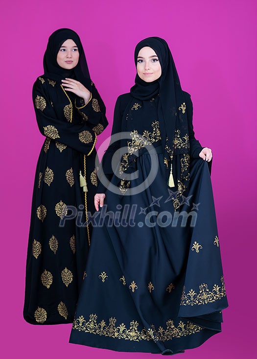 beautiful muslim woman in fashinable dress with hijab isolated on modern plastic pink background in studio representing concept of modern islam and ramadan kareem beautiful muslim woman in fashinable dress with hijab isolated on modern plastic pink background in studio representing concept of modern islam and ramadan kareem