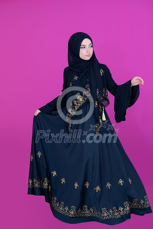 beautiful muslim woman in fashinable dress with hijab isolated on modern plastic pink background representing modern islam fashion and ramadan kareem concept beautiful muslim woman in fashinable dress with hijab isolated on modern plastic pink background representing modern islam fashion and ramadan kareem concept