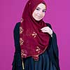 beautiful muslim woman in fashinable dress with hijab isolated on modern plastic pink background representing modern islam fashion and ramadan kareem concept