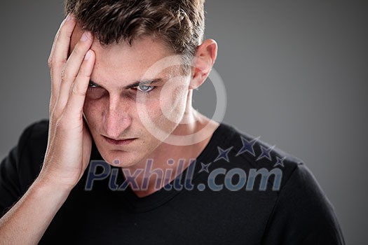 Fear/anxiety/regret/uncertainty in a young man - effects of a difficult life situation - vivid emotions concept Fear/anxiety/regret/uncertainty in a young man - effects of a difficult life situation - vivid emotions concept
