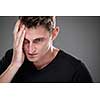 Fear/anxiety/regret/uncertainty in a young man - effects of a difficult life situation - vivid emotions concept