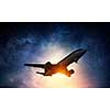 Airplane for transportation flying in night sky