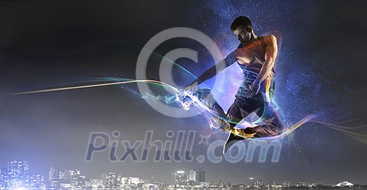 Breakdancer in jump against modern city background. Mixed media Breakdancer in jump against modern city background. Mixed media