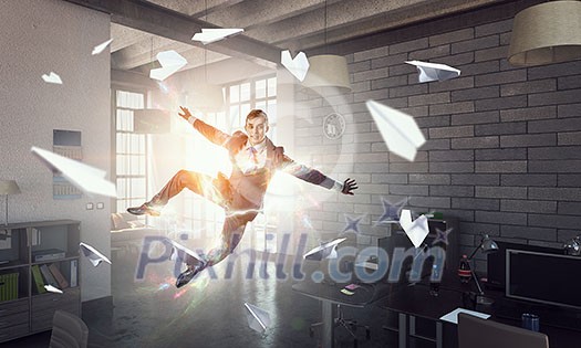 Happy cheerful businessman in office dancing and jumping. Mixed media Happy cheerful businessman in office dancing and jumping. Mixed media