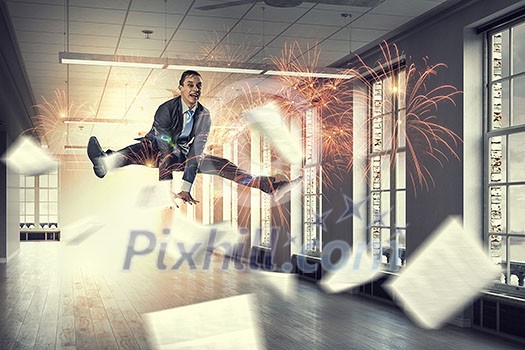 Happy cheerful businessman in office dancing and jumping. Mixed media Happy cheerful businessman in office dancing and jumping. Mixed media