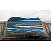 Book with natural landscape on pages. Mixed media