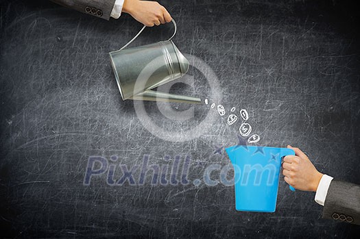 Close up of businessman hand holding can Close up of businessman hand holding can