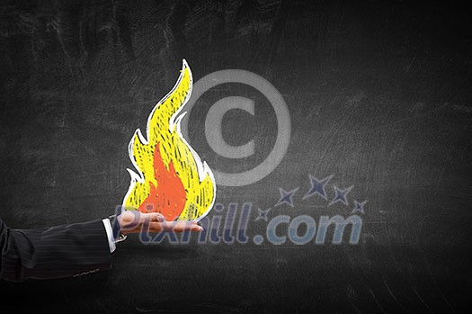Hand of businessperson holding fire in palm Hand of businessperson holding fire in palm
