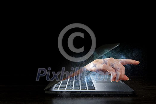Hand coming out of laptop monitor. Mixed media Hand coming out of laptop monitor. Mixed media