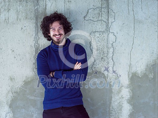 portrait of young male architect on construction site while checking documents and business workflow in new startup office
