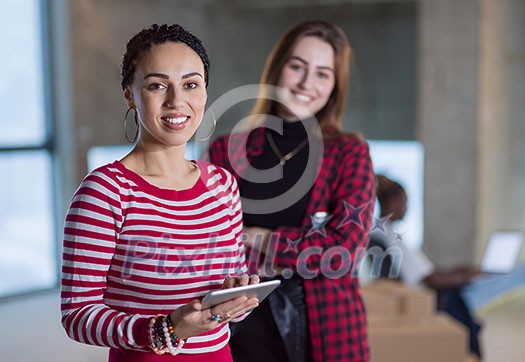 young multiethnic team of business people in group, architect and engineer on construction site checking documents and business workflow using laptop and tablet computer in new startup office young multiethnic team of business people in group, architect and engineer on construction site checking documents and business workflow using laptop and tablet computer in new startup office