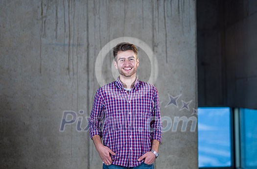 portrait of young male architect on construction site while checking documents and business workflow in new startup office portrait of young male architect on construction site while checking documents and business workflow in new startup office