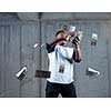 business, people and finances concept  Happy young african american businessman throwing US dollar banknotes and enjoying while making the rain of money in new startup office