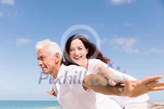 Couple having fun on the beach Couple having fun on the beach