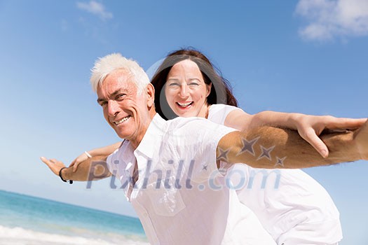 Couple having fun on the beach Couple having fun on the beach