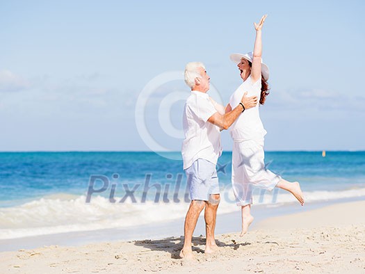 Happy couple together on the beach Happy couple together on the beach