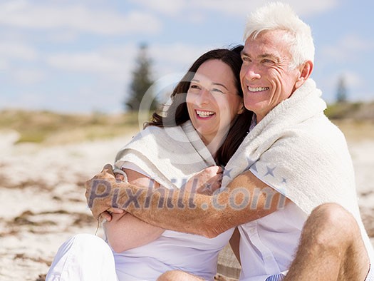 Happy couple together on the beach Happy couple together on the beach