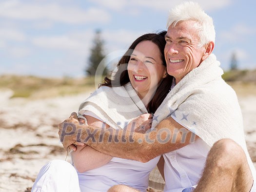 Happy couple together on the beach