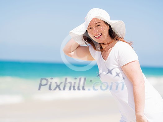 Woman in white clothes on the beach on sunny day Woman in white clothes on the beach on sunny day