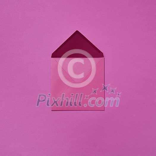 Mock up handcraft open envelope for congratulation post card on a magenta background with copy space. Flat lay Mock up handcraft open envelope for congratulation post card on a magenta background with copy space. Flat lay