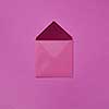 Mock up handcraft open envelope for congratulation post card on a magenta background with copy space. Flat lay