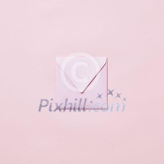 Empty handmade envelope for congratulation card on a light pink background with copy space. Mockup. Empty handmade envelope for congratulation card on a light pink background with copy space. Mockup.