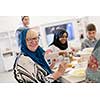 modern multiethnic muslim family enjoying eating iftar dinner together during a ramadan feast at home
