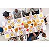 top view of modern multiethnic muslim family praying before having iftar dinner together during a ramadan feast at home