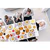 top view of modern multiethnic muslim family praying before having iftar dinner together during a ramadan feast at home