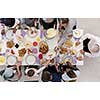 top view of modern multiethnic muslim family enjoying eating iftar dinner together during a ramadan feast at home