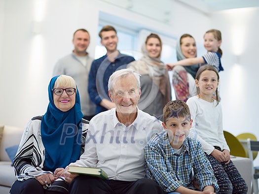 several generations portrait of happy modern muslim family before iftar dinner during ramadan feast at home several generations portrait of happy modern muslim family before iftar dinner during ramadan feast at home