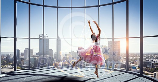 Ballerina kid girl in pink dress dancing. Mixed media Ballerina kid girl in pink dress dancing. Mixed media