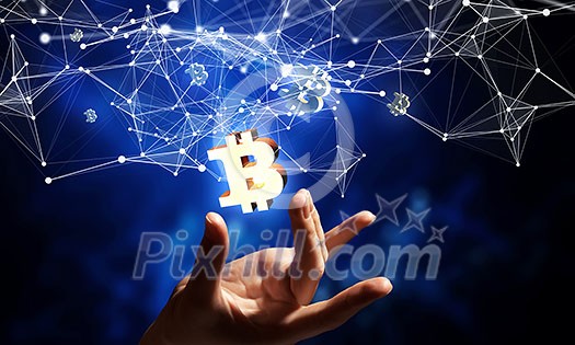 Bitcoin symbol and connection lines in male hand as concept for cryptocurrency. 3d rendering Bitcoin symbol and connection lines in male hand as concept for cryptocurrency. 3d rendering