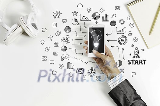 Top view of woman sitting at table and using smartphone Top view of woman sitting at table and using smartphone