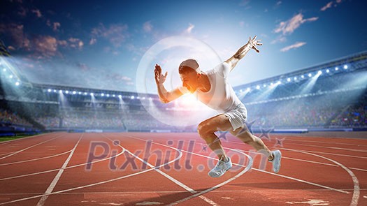 Athlete man running on racetrack at stadium. Mixed media Athlete man running on racetrack at stadium. Mixed media